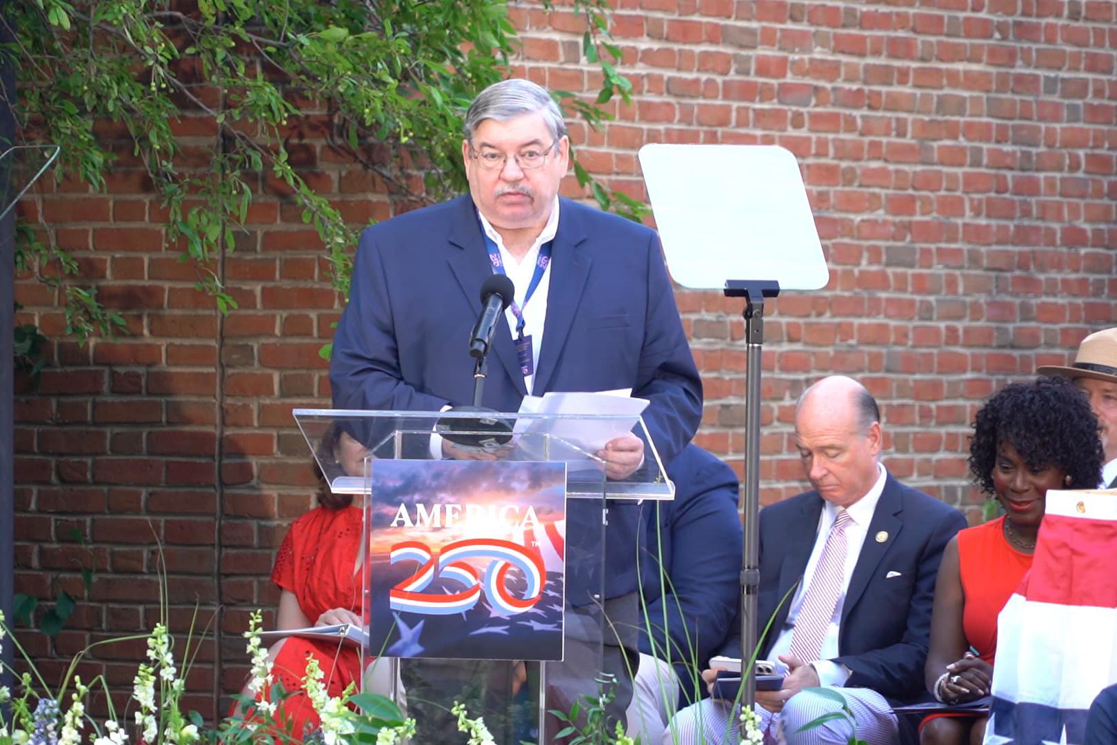 Thomas Caramanico, executive director of the Independence Historical Trust, delivered remarks at the ceremony to bury the Time Capsule at Independence Hall in Philadelphia on July 4, 2026. (William Huang /The Epoch Times)