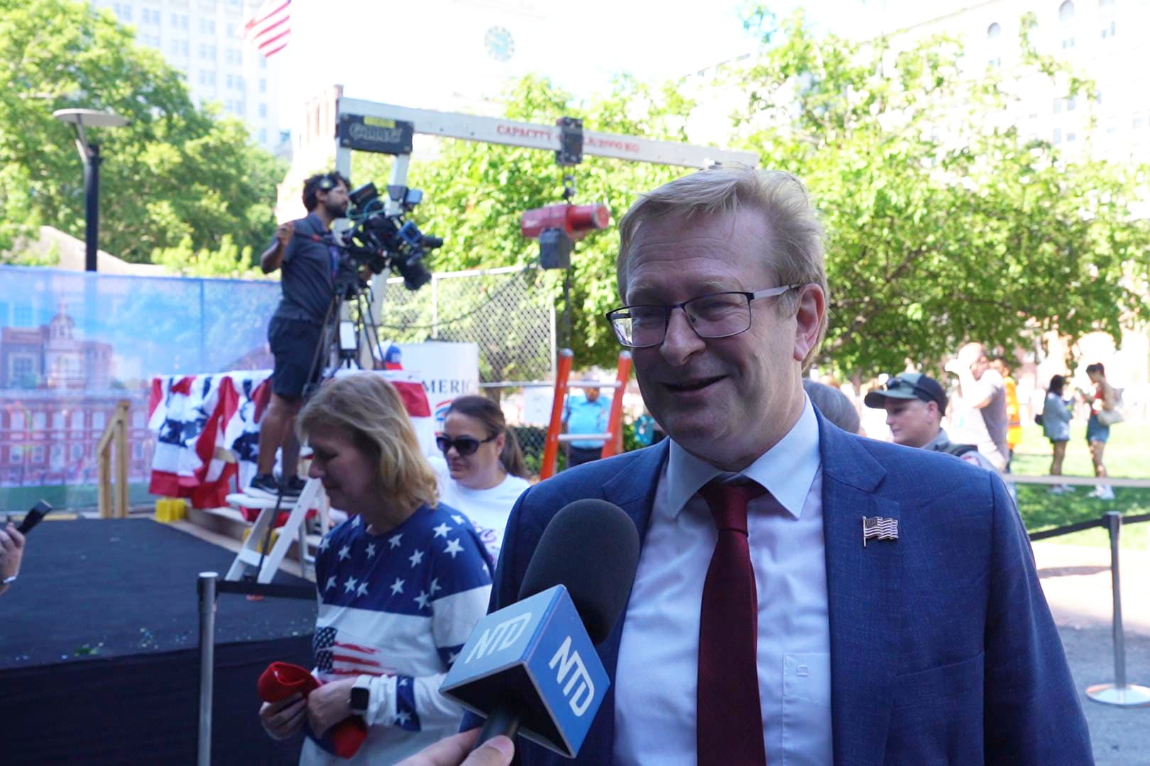 Thomas Schulze, a German American psychiatrist and professor, attended the ceremony burying the United States’ Semiquincentennial time capsule held on the lawn at Independence Hall on July 4, 2026. (William Huang /The Epoch Times)