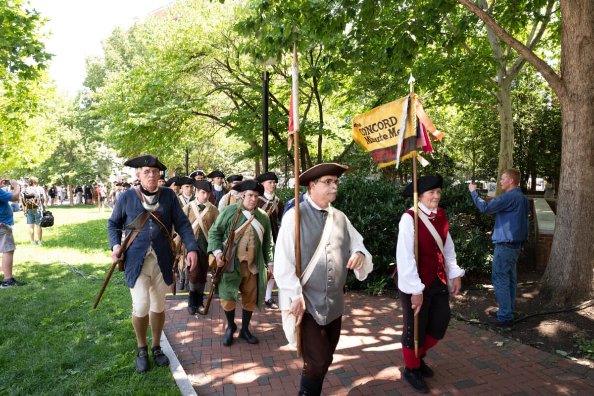 Performers and visitors take part in the celebration around Philadelphia Independence Mall, to celebrate America's 250th anniversary, on July 3, 2026. (Larry Dye/The Epoch Times)