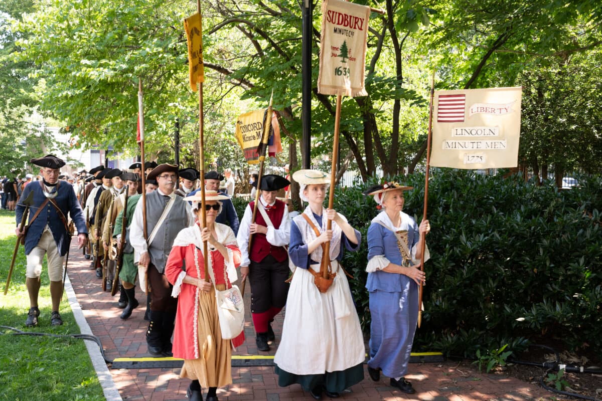 A parade of costumed participants braves the heat to march around Philadelphia Independence Mall, in a celebration of America's 250th anniversary, on July 3, 2026. (Larry Dye/The Epoch Times)