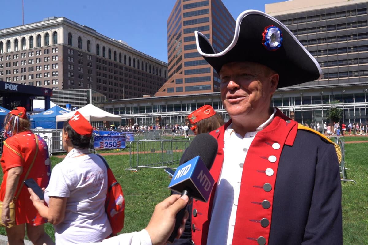 Jim Fendrick, a financial adviser and member of National Society Sons of the American Revolution, attends the celebration with his sons at the Independence National Historical Park, Philadelphia, on July 3, 2026. (Nancy Wang/The Epoch Times)