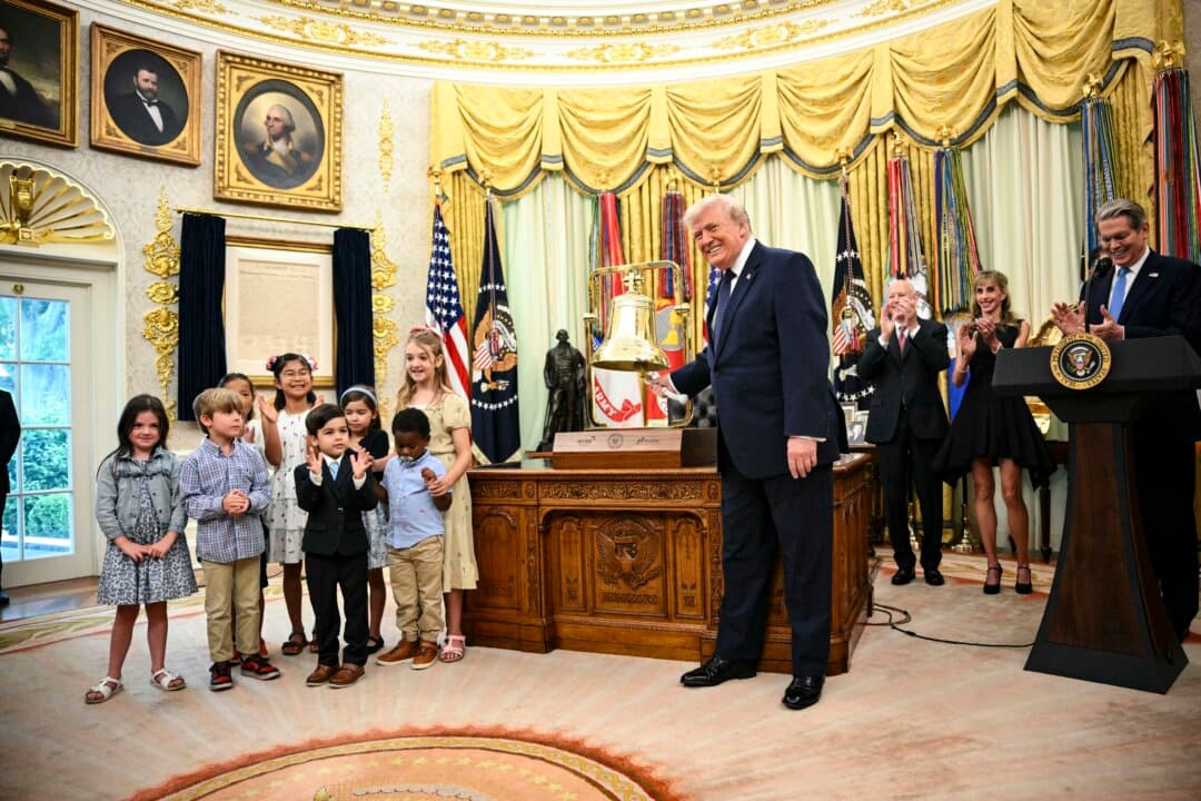 U.S. President Donald Trump rings the opening bell of the New York Stock Exchange ahead of the launch of Trump Accounts in the Oval Office of the White House in Washington on July 6, 2026. Trump Accounts are a new type of tax-deferred investment account for children. (Mandel Ngan/AFP via Getty Images)