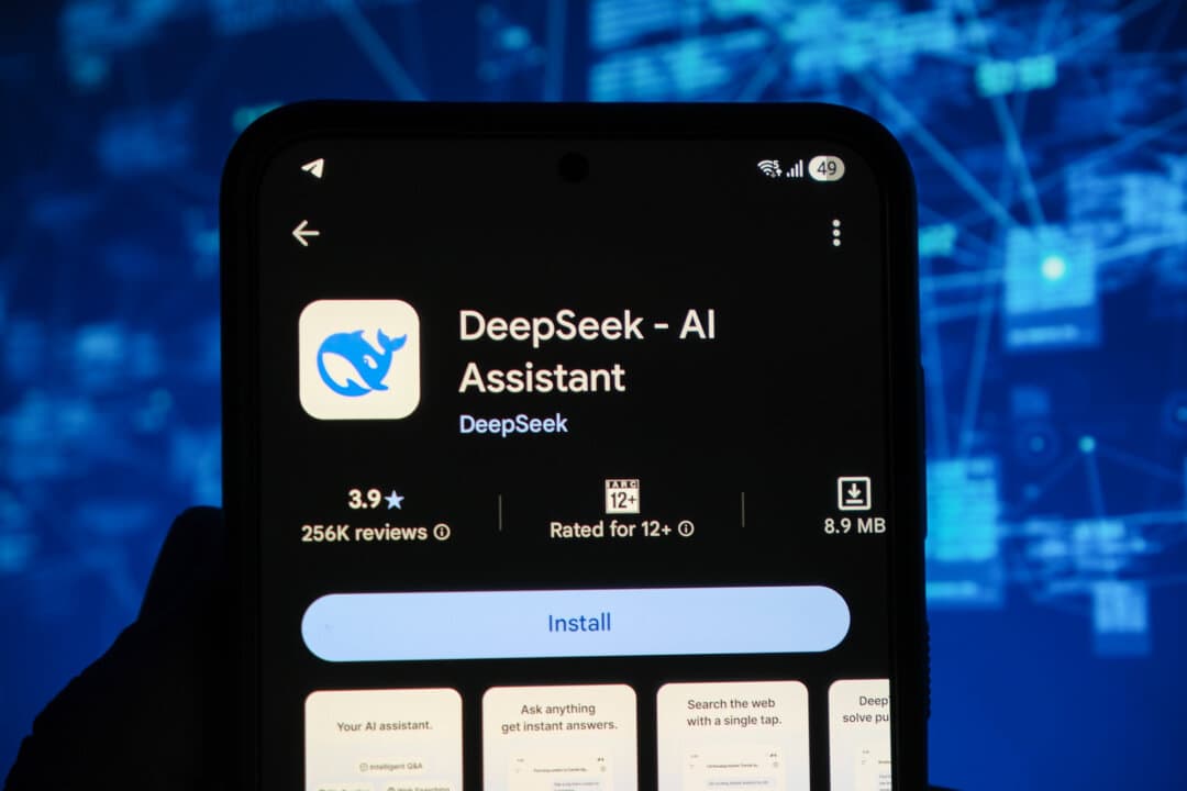 The DeepSeek app is displayed on a phone screen in this photo illustration. Anthropic has accused DeepSeek and other Chinese AI developers of attempting to train their models using its Claude chatbot. (Oleksii Pydsosonnii/The Epoch Times)