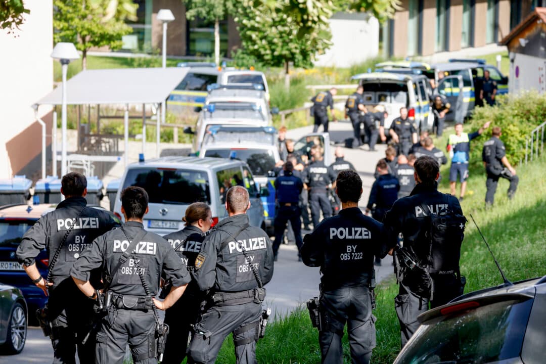 Police officers are pictured at a secondary school where several people were wounded in an attack, in Schongau, Germany, on July 8, 2026. A 16-year-old suspect armed with a knife and firearm was arrested. (Michaela Stache/AFP via Getty Images)