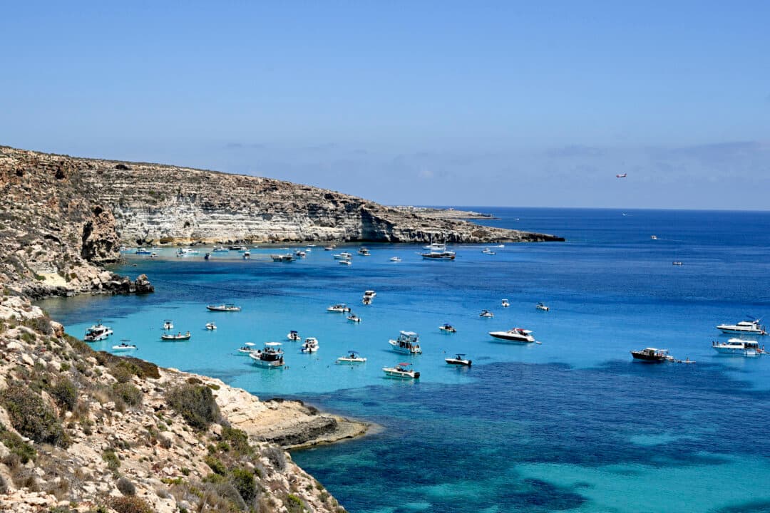 Boats anchored at Cala Tabaccara cove in the Italian island of Lampedusa, on July 6, 2026. (Tiziana Fabi/AFP via Getty Images)