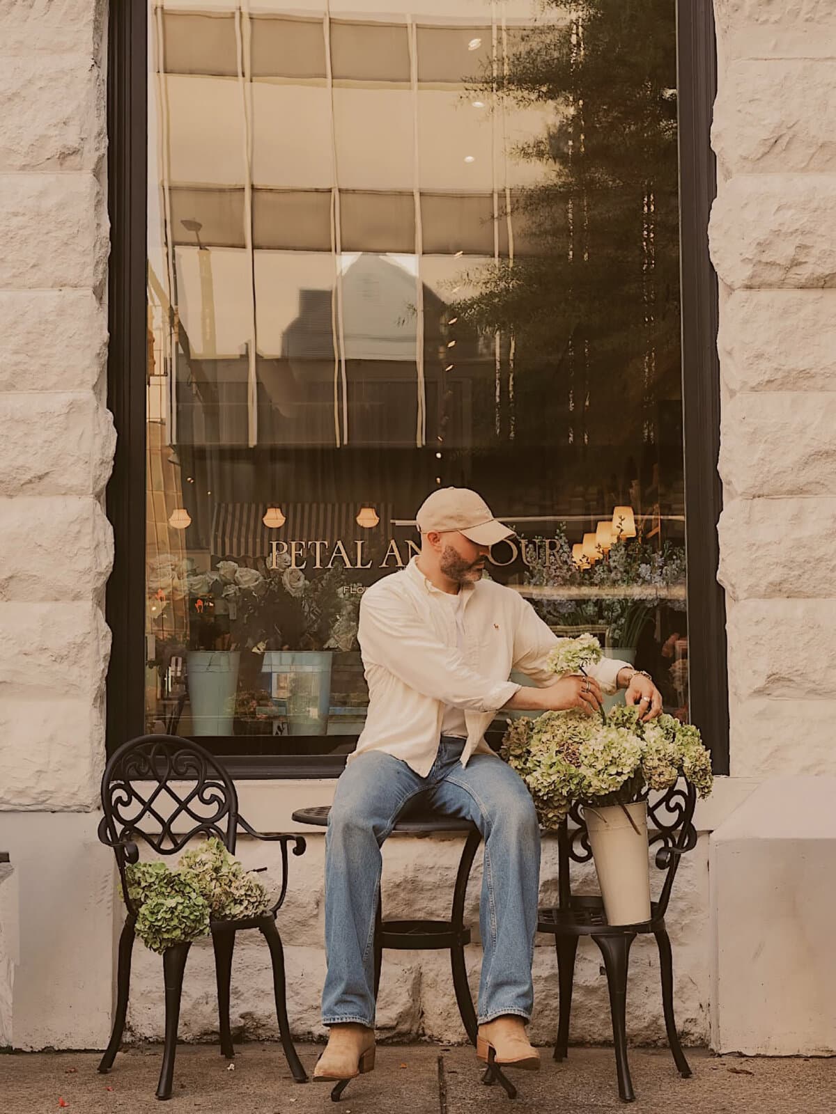 Owner Keegan Chitwood, sitting outside of Petal and Pour. (Ansley Suddeth Photography/TNS)
