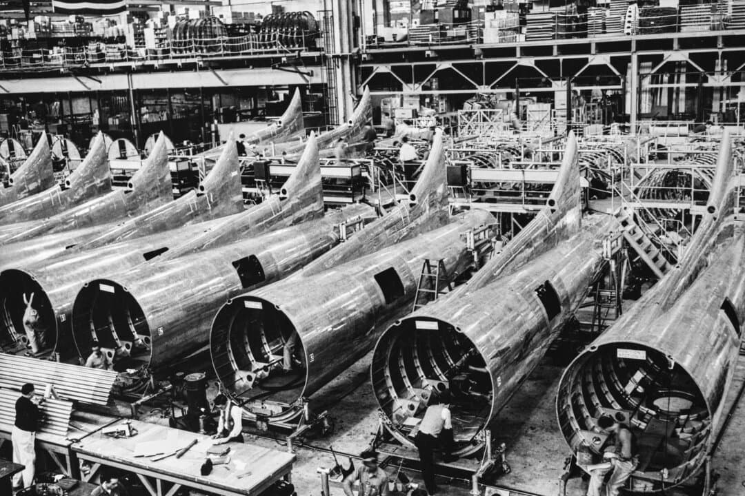 Partially completed rear fuselage and tail sections of the Boeing B-17 Flying Fortress bomber at a Boeing assembly facility in Seattle, circa December 1942. The wartime mobilization effort created millions of new jobs, bringing the U.S. economy back to its feet after the Depression. (Keystone View Company/Archive Photos/Getty Images)