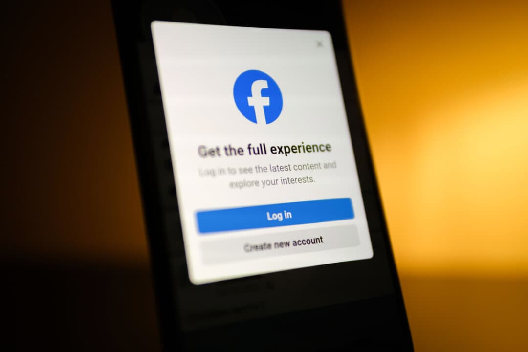 The Facebook app is displayed on a phone, in this file photo. Jennifer Combs was arrested after expressing concerns about water quality in Trinidad, Texas, on her Facebook page, “Southern Belle Watch.” (Oleksii Pydsosonnii/The Epoch Times)