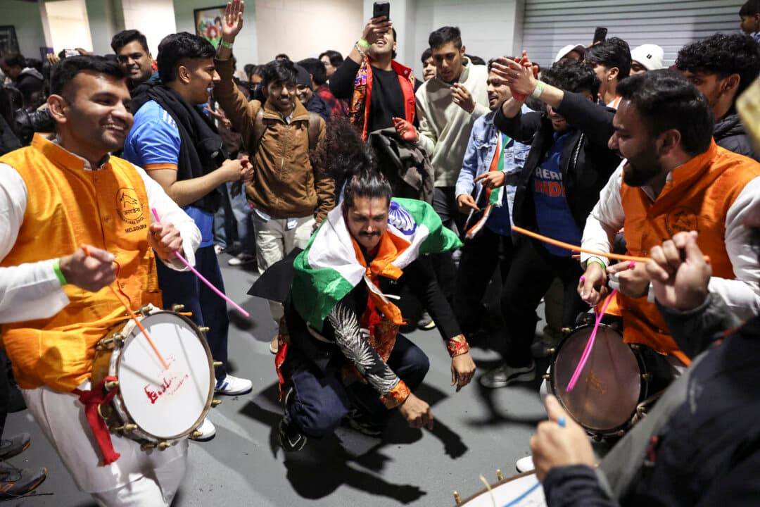 Members of the Indian community react after listening to Indian Prime Minister Narendra Modi speak at a community event at Docklands Stadium in Melbourne, Australia, on July 9, 2026. (Martin Keep/AFP via Getty Images)