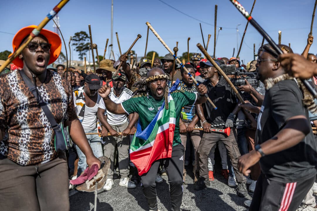 Protesters in traditional attire chant slogans during a demonstration by the “March and March” movement in Mtwalume, south of Durban, South Africa, on July 9, 2026. (Rajesh Jantilal/AFP via Getty Images)