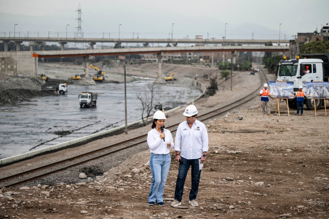 Peru's president-elect for the Fuerza Popular party, Keiko Fujimori (L), speaks next to Lima Mayor Renzo Reggiardo (R) during a cleaning and desilting operation on the Rimac river as a preventive measure against the El Niño phenomenon, in Lima, Peru, on July 9, 2026. (Ernesto Benavides/AFP via Getty Images)