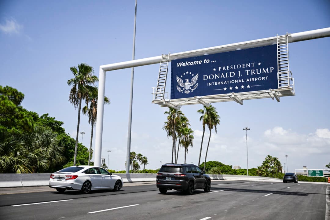 A new welcome sign reading “Donald J. Trump International Airport” is seen at the airport's main entrance ramp in West Palm Beach, Fla., on July 9, 2026. (Chandan Khanna/AFP via Getty Images)