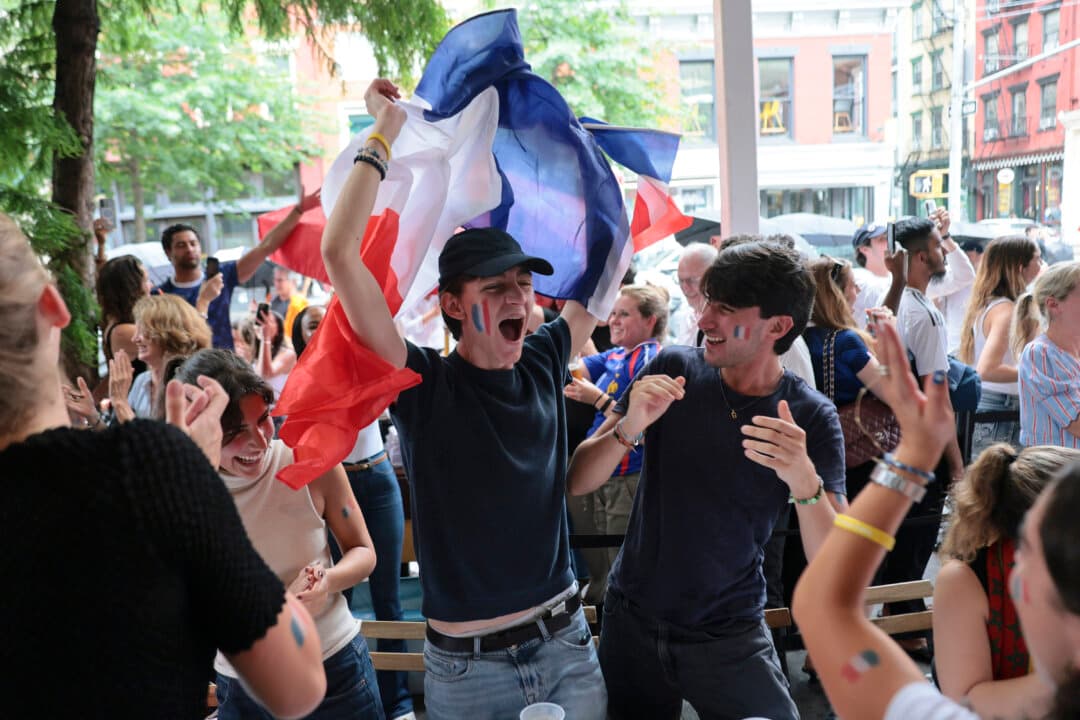 Fans react to a second goal by France as they attend a watch party for the France vs. Morocco FIFA World Cup quarterfinal match at Felix Restaurant & Bar in New York City on July 9, 2026. The French Bistro was at full capacity with people cheering on the French team as they won 2–0. (Michael M. Santiago/Getty Images)