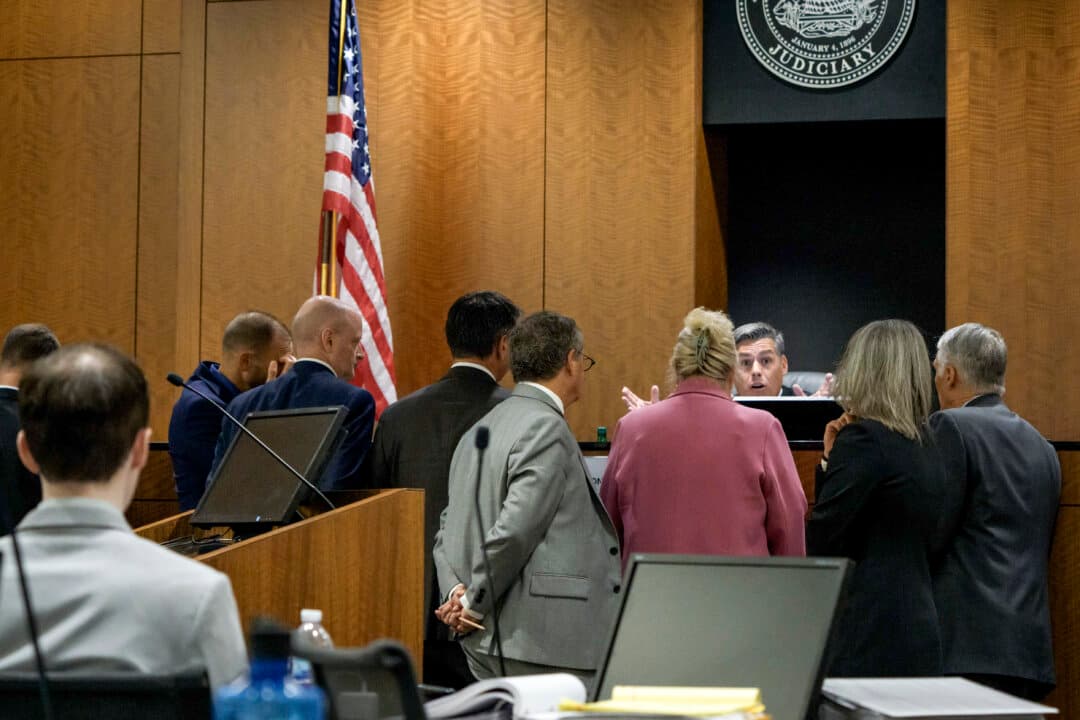 Tyler Robinson (L), who is accused in the fatal shooting of Charlie Kirk, sits while Judge Tony Graf conferences with attorneys during a preliminary hearing at the Fourth District Courthouse in Provo, Utah, on July 9, 2026. (Spenser Heaps - Pool/Getty Images)