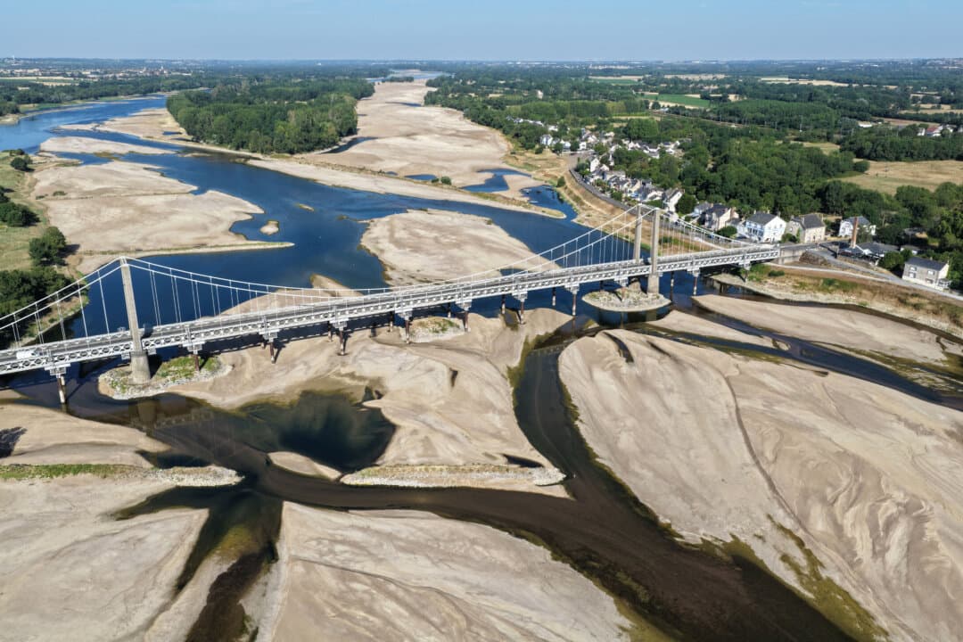 A bridge spanning the dried-up bed of the Loire River in Loireauxence, France, on July 10, 2026. (Damien Meyer/AFP via Getty Images)
