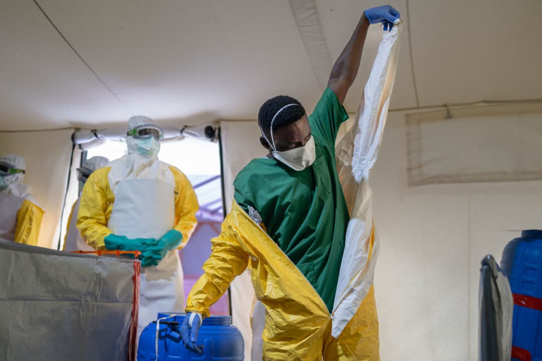 A health worker demonstrates the safe removal of personal protective equipment (PPE) during an Ebola response training exercise organized by Médecins Sans Frontières (MSF) in Ongata Rongai, Kajiado County, Kenya, on July 10, 2026. The training aims to strengthen regional preparedness following the Ebola outbreak in the Congo. (Tony Karumba/AFP via Getty Images)