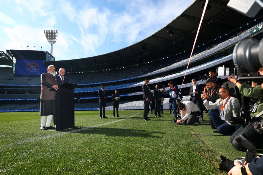 Indian Prime Minister Narendra Modi speaks alongside Australia's Prime Minister Anthony Albanese during a visit to the Melbourne Cricket Ground in Melbourne, Australia, on July 10, 2026. (Daniel Pockett/Getty Images for Cricket Australia)