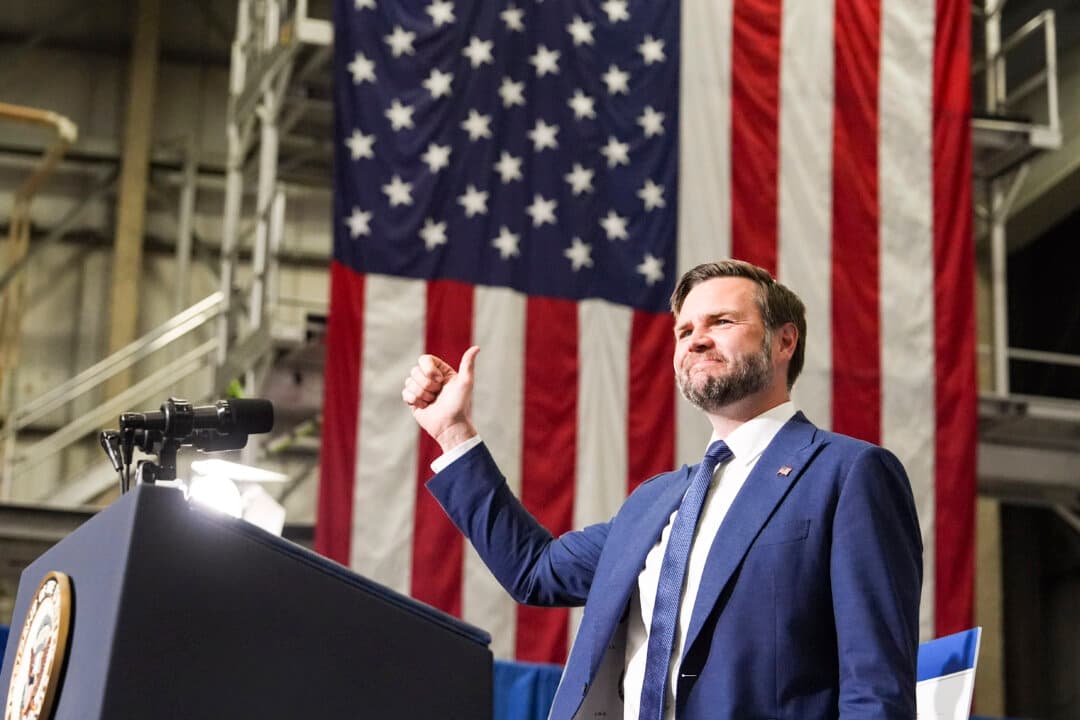 U.S. Vice President JD Vance speaks at the Wisconsin Air National Guard facility at Milwaukee Mitchell International Airport, in Wisconsin, on July 8, 2026. Vance traveled to Milwaukee to deliver remarks on the Trump administration's anti-fraud initiatives. (Mark Schiefelbein-Pool/Getty Images)