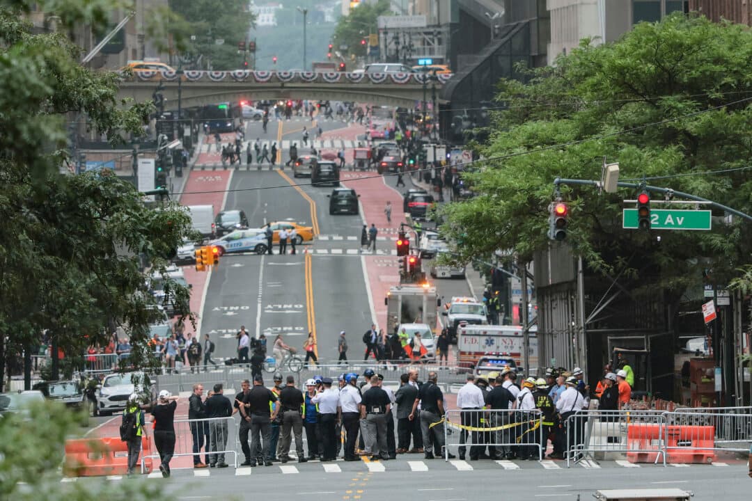Emergency personnel gather near the former Pfizer headquarters building in New York City, on July 7, 2026. The project, which architects said would be the largest of its kind in New York City history, was scheduled to be completed in 2027. (Michael M. Santiago/Getty Images)