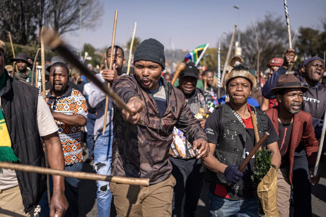 Protesters march during an anti-migration demonstration in Norwood, South Africa, on July 11, 2026. (Emmanuel Croset/AFP via Getty Images)