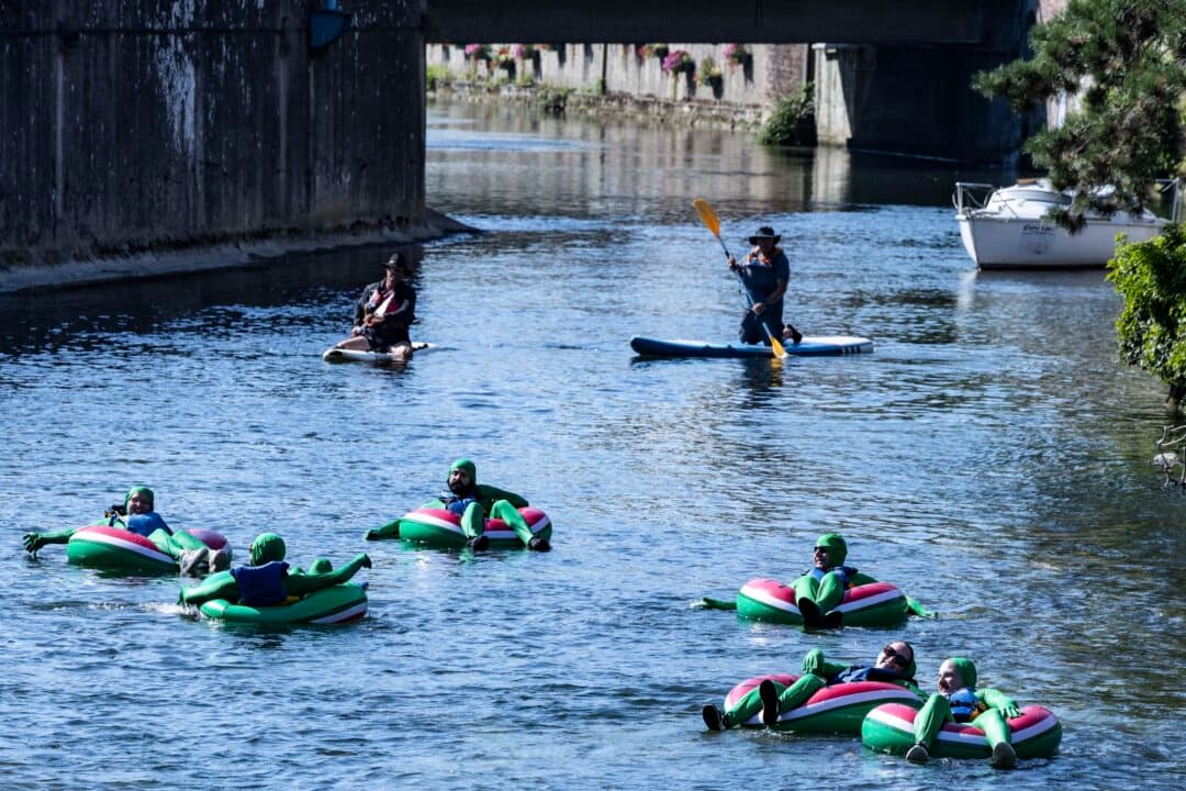 Participants in the “Mascarets” festival float down the Risle River on inner tubes during a heatwave in Pont-Audemer, France, on July 11, 2026. (Joel Saget/AFP via Getty Images)
