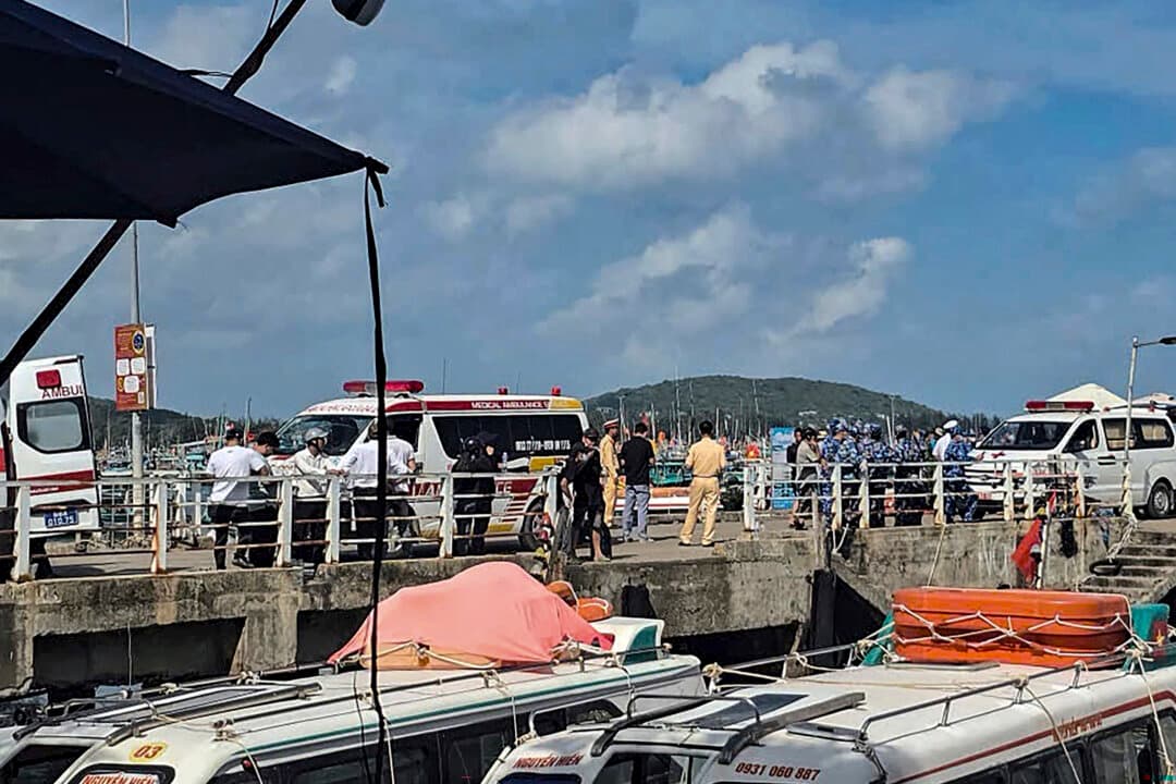Ambulances line up on a pier to help victims of a boating accident after a tourist vessel capsized off Phu Quoc island in Vietnam's An Giang province, on July 11, 2026. At least 15 people were killed. (AFP via Getty Images)