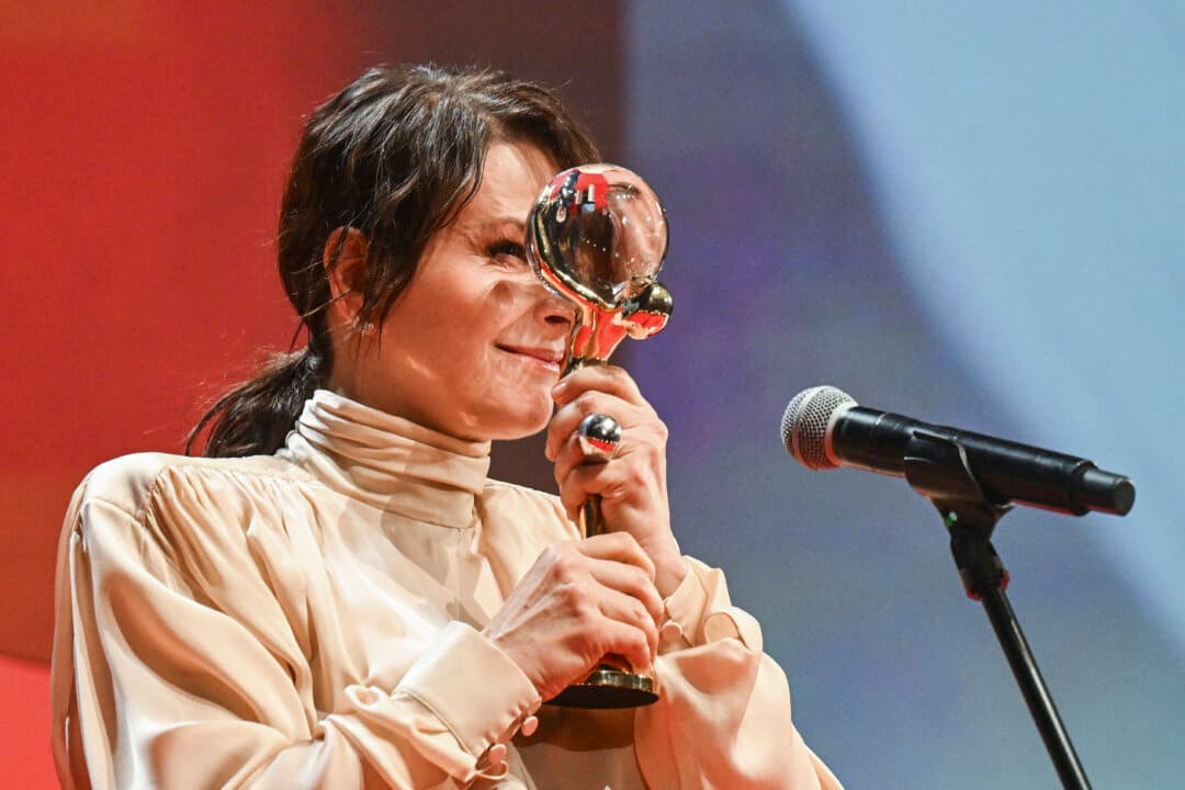 French actress Juliette Binoche reacts on stage after having been awarded with the Crystal Globe for Outstanding Artistic Contribution to World Cinema during the closing ceremony of the 60th Karlovy Vary International Film Festival in Karlovy Vary, Czech Republic, on July 11, 2026. (Michal Cizek/AFP via Getty Images)