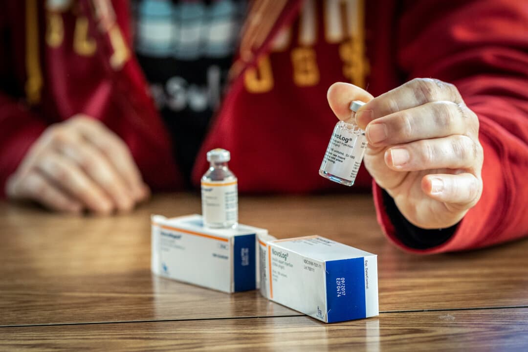 A man looks at insulin drugs NovoRapid and NovoLog in Eveleth, Minn., on Jan. 16, 2020. Diabetes is one of several conditions that have driven billions in risk-adjusted payments to Medicare Advantage companies, according to the Department of Health and Human Services. (Kerem Yucel/AFP via Getty Images)