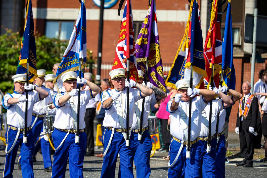 Band members prepare to take part in a parade at Carlisle circus in Belfast, England, on July 13, 2026, to celebrate the battle of the Boyne in 1690 when the Protestant King William of Orange defeated the Catholic King James. (Paul Faith/AFP via Getty Images)