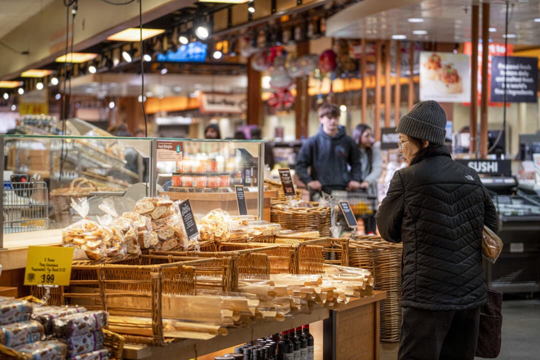 A woman shops at a grocery store in Columbia, Md., on Jan. 7, 2024. Homesteading expert Ruth Ann Zimmerman encourages grocery store customers to ask, “Where did this grow, who grew it, and how was it grown?” (Madalina Kilroy/The Epoch Times)