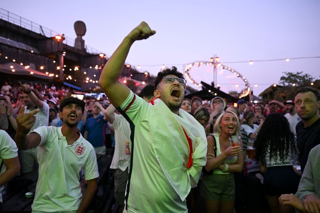 Football fans react to an England goal as they watch the semi-final match between England and Argentina in the FIFA World Cup 2026 at Freight Island in Manchester, England, on July 15, 2026. (Anthony Devlin/Getty Images)