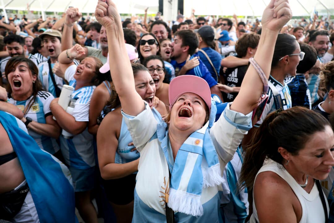People react as Argentina beats England during a FIFA World Cup match watch party at the Miami Beach Bandshell in Miami Beach, Fla., on July 15, 2026. Argentina and England were playing in the semifinal match in Atlanta. (Joe Raedle/Getty Images)