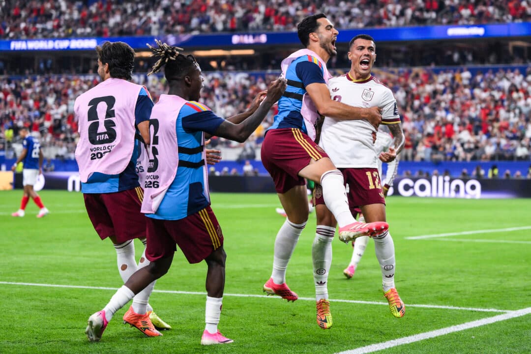 Pedro Porro #12 of Spain celebrates scoring his team's second goal during the FIFA World Cup 2026 semifinal match between France and Spain at Dallas Stadium in Arlington, Texas, on July 14, 2026. (David Ramos/Getty Images)