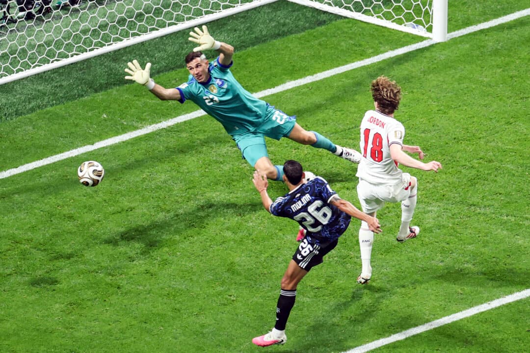 England's forward #18 Anthony Gordon scores his team's first goal past Argentina's goalkeeper #23 Emiliano Martinez during the 2026 World Cup football tournament semi-final match between England and Argentina at the Atlanta Stadium in Atlanta, Ga., on July 15, 2026. (Patricia de Melo Moreira/AFP via Getty Images)