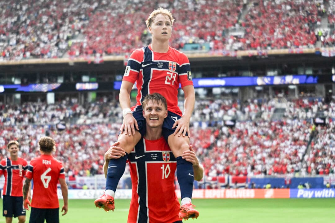 Norway's midfielder #21 Andreas Schjelderup celebrates scoring his team's first goal on the shoulders of midfielder #10 Martin Odegaard during the 2026 World Cup football tournament quarter-final match between Norway and England at Miami Stadium in Miami Gardens on July 11, 2026. (Mauro Pimentel/AFP via Getty Images)