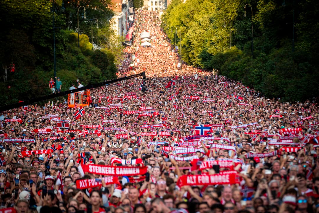 Supporters wave for Norway's national soccer team at Slottsplassen in Oslo after their return to Norway from the USA on July 13, 2026. Norway were knocked out in the quarter-final match against England. (Trond Reidar Teigen/NTB/AFP via Getty Images)