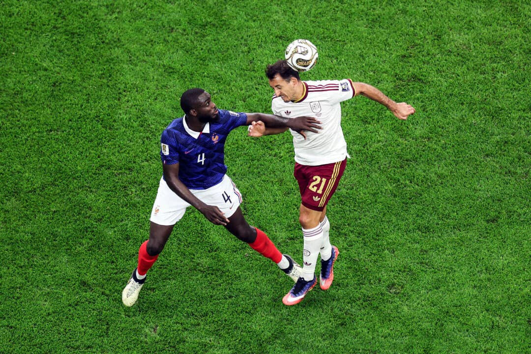 Mikel Oyarzabal #21 of Spain heads the ball against Dayot Upamecano #4 of France during the FIFA World Cup 2026 semifinal match between France and Spain at Dallas Stadium in Arlington, Texas, on July 14, 2026. (Kevin C. Cox/Getty Images)