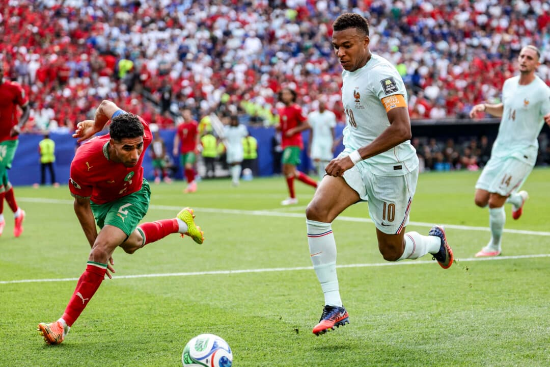 Morocco's defender #2 Achraf Hakimi and France's forward #10 Kylian Mbappe fight for the ball during the 2026 World Cup football tournament quarter-final match between France and Morocco at Boston Stadium in Foxborough, Mass., on July 9, 2026. (Odd Andersen/AFP via Getty Images)