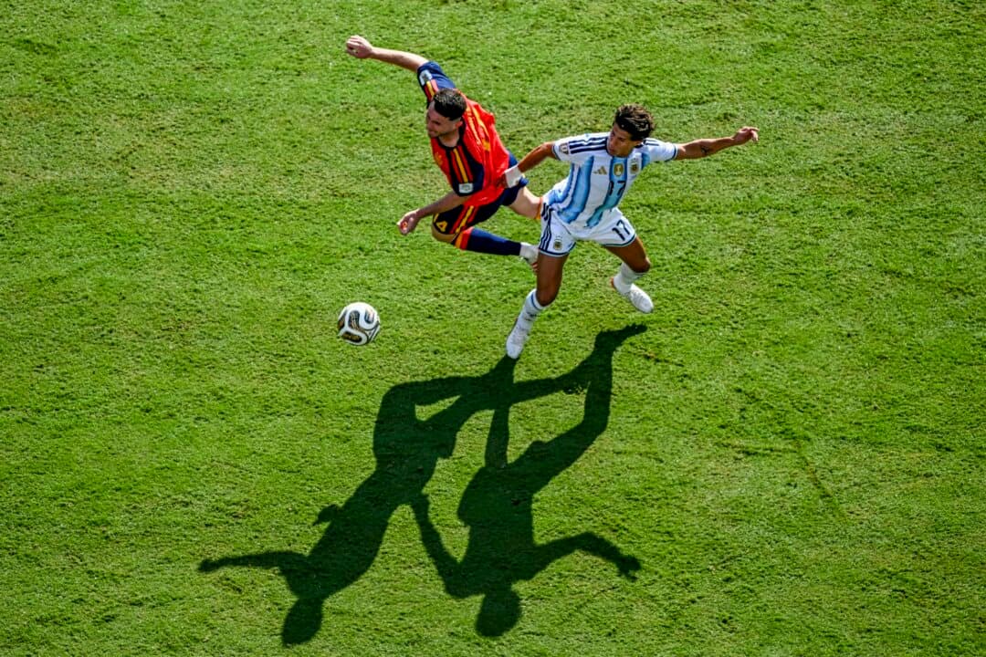 Spain's defender #14 Aymeric Laporte and Argentina's forward #17 Giuliano Simeone fight for the ball during the 2026 World Cup football tournament final match between Spain and Argentina at the New York New Jersey Stadium in East Rutherford, N.J., on July 19, 2026. (Jewel Samad/AFP via Getty Images)