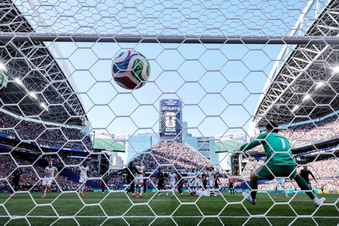 Thibaut Courtois #1 of Belgium concedes a first goal from a free kick by Malik Tillman #17 of the United States during the FIFA World Cup 2026 Round of 16 match between the USA and Belgium at Seattle Stadium in Seattle, Wash., on July 6, 2026. (Jamie Squire/Getty Images)