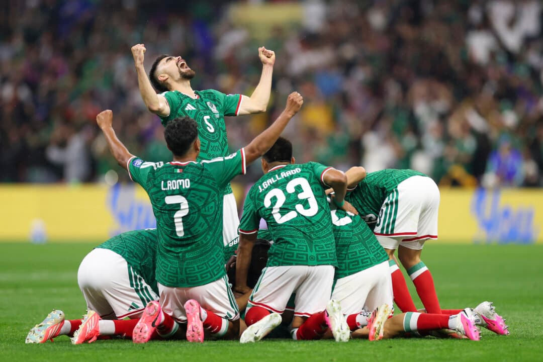 Raul Jimenez #9 of Mexico celebrates scoring his team's second goal with Johan Vasquez #5 and teammates during the FIFA World Cup 2026 Round of 32 match between Mexico and Ecuador at Mexico City Stadium in Mexico City on June 30, 2026. (Carl Recine/Getty Images)