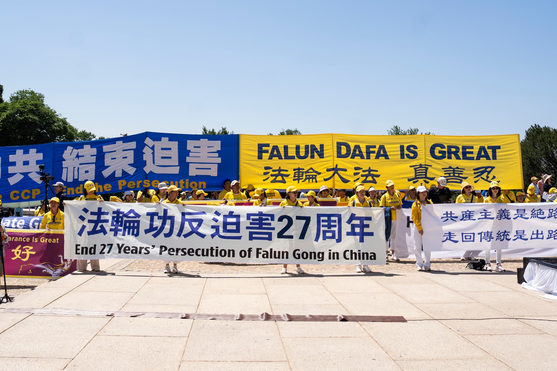 Falun Dafa practitioners take part in the annual rally calling for the end of the Chinese Communist Party’s ongoing persecution of Falun Gong in China, at the Lincoln Memorial in Washington on July 23, 2026. (Madalina Kilroy/The Epoch Times)