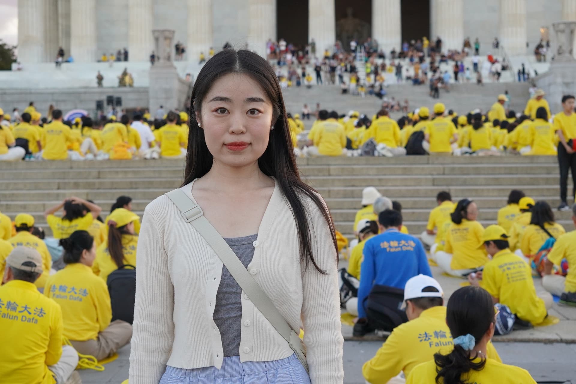 Bai Shuyuan, a Falun Gong practitioner, before a candlelight vigil at the Lincoln Memorial in Washington on July 23, 2026. (Terri Wu/The Epoch Times)