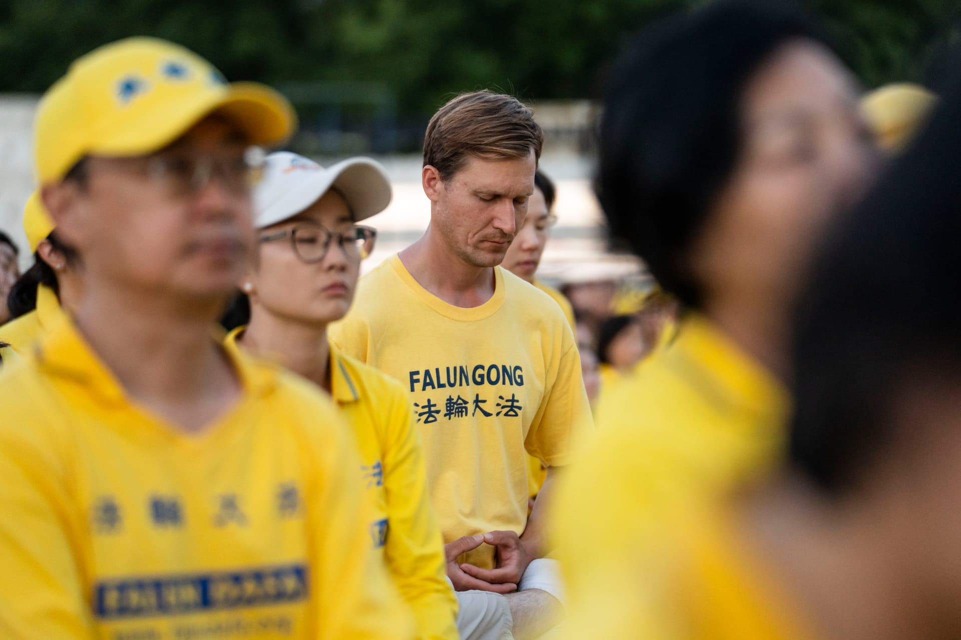 Anton Khmelev, a Falun Gong practitioner from Middletown, N.Y., before a candlelight vigil at the Lincoln Memorial in Washington on July 23, 2026. (Madalina Kilroy/The Epoch Times)