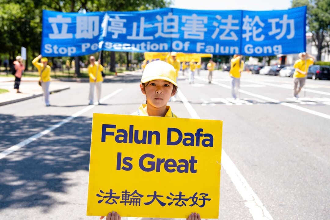 A young girl takes part in the march in Washington on July 23, 2026. (Samira Bouaou/The Epoch Times)