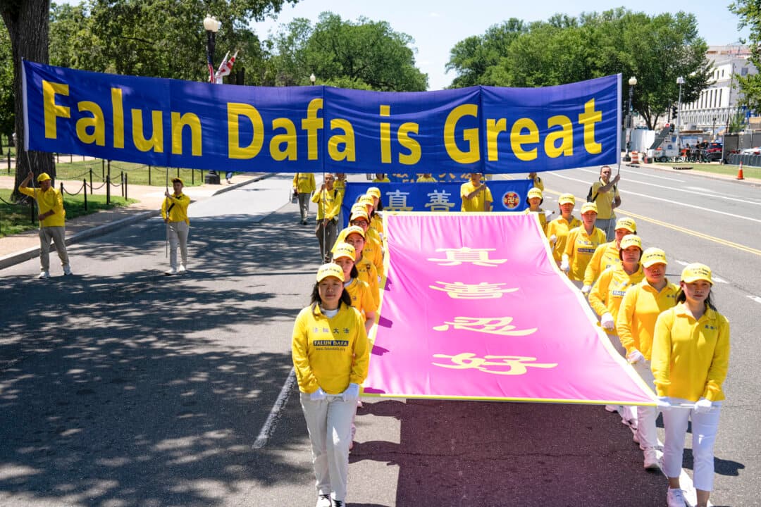 Falun Dafa practitioners march in Washington on July 23, 2026. (Larry Dye/The Epoch Times)