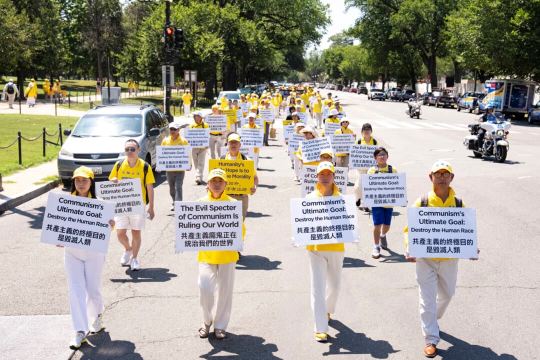 Falun Dafa practitioners march in Washington on July 23, 2026. (Larry Dye/The Epoch Times)