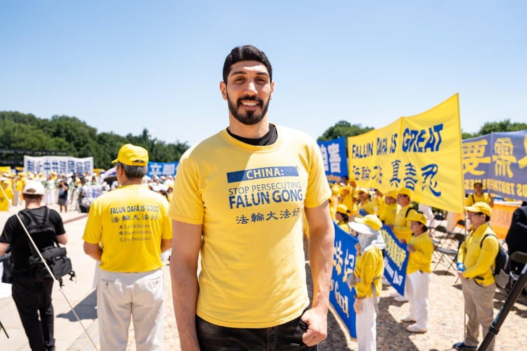 Enes Kanter Freedom, human rights advocate and former NBA player, joins Falun Dafa practitioners gather for the annual rally in Washington on July 23, 2026. (Samira Bouaou/The Epoch Times)