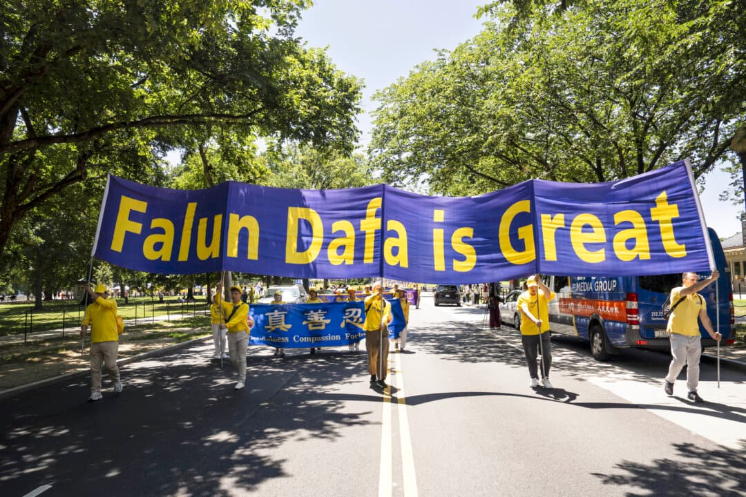 Falun Dafa practitioners march in Washington on July 23, 2026. (Madalina Kilroy/The Epoch Times)