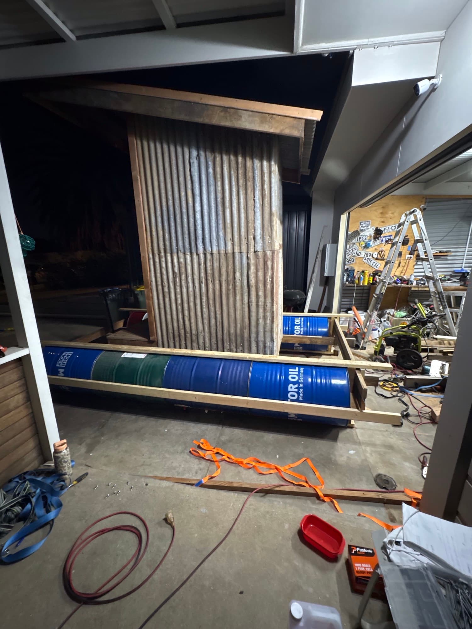 Alex Craig's contraption in a shed, where he used empty metal barrels to keep the device afloat. (Courtesy of Alex Craig)
